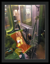 Photo On The New York City Subway - Framed Print